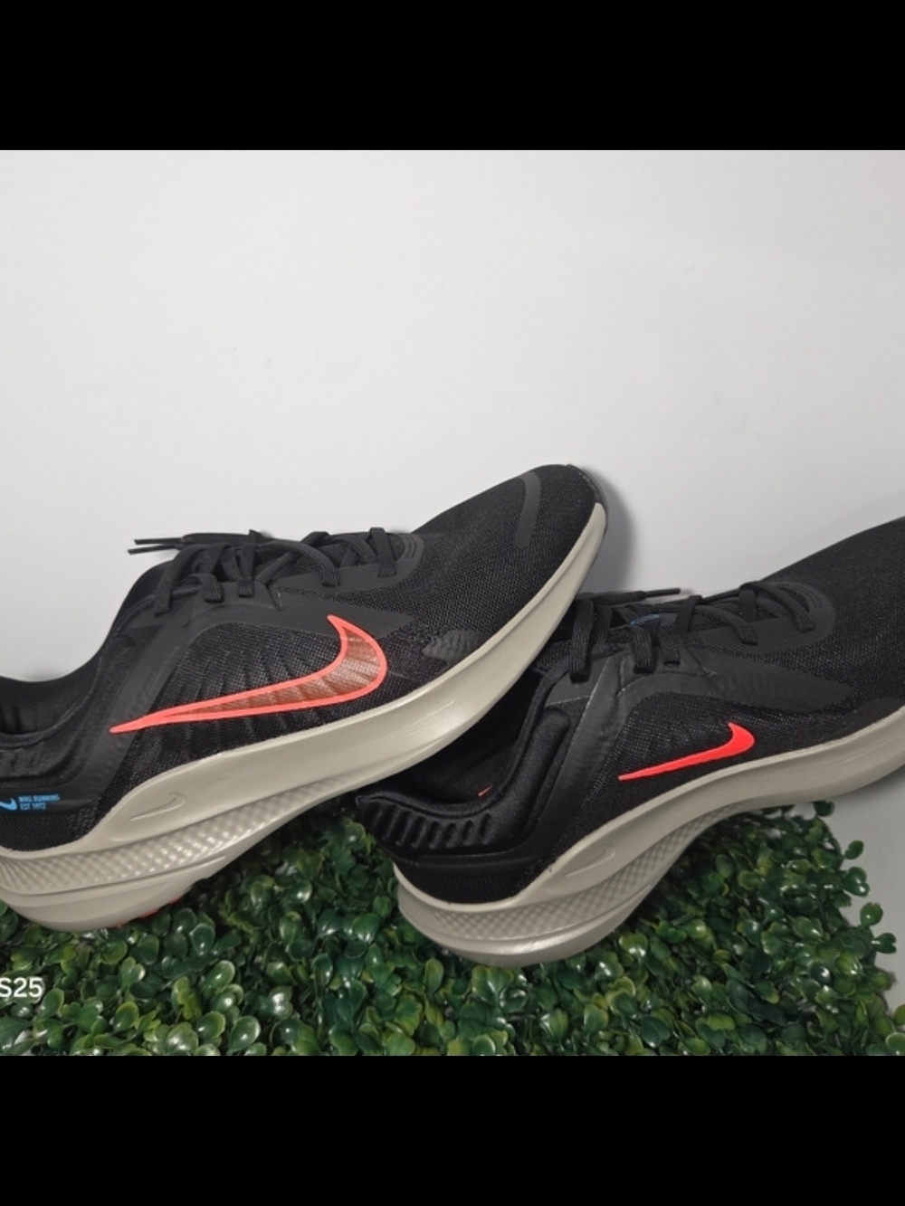 Nike Men’s Black Sneakers with Bright Coral Swoosh